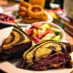 Patty melt (medium rare) with fruit and a bonus side of onion rings.