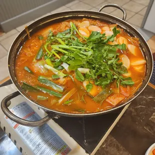 a pot of stew on a stove