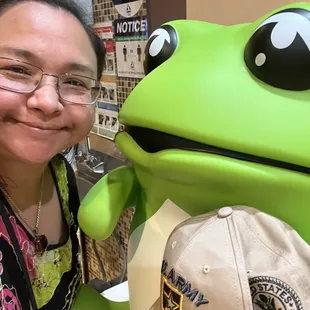 a woman posing with a frog