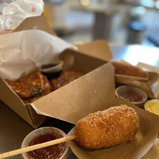 a box of donuts and dipping sauces