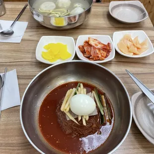 Spicy cold noodles, banchan, my friend got the dumpling soup