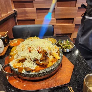 Torching the cheese on Galbi Jjim