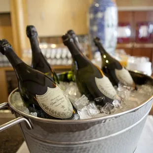 four bottles of champagne in a bucket