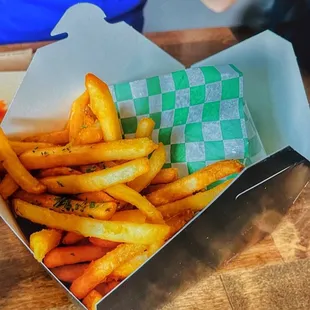 a basket of french fries on a table