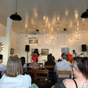 a group of people sitting in a cafe