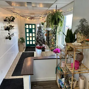 a long hallway with a christmas tree