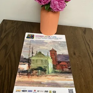 pink flowers in a pot on a table