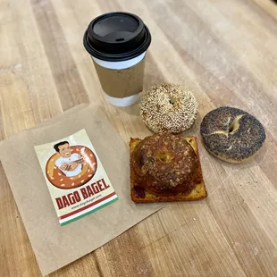 a cup of coffee, a bagel, and a bagel