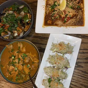a variety of dishes of food on a table