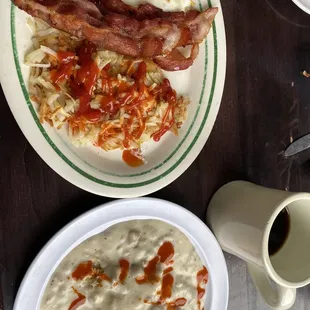 Biscuits and gravy, bacon, hash browns and eggs over easy