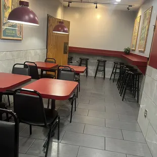 empty tables and chairs in a restaurant