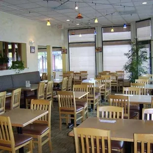 a restaurant with tables and chairs