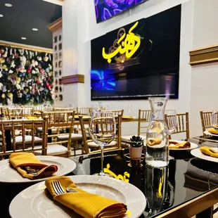 a dining area with tables and chairs