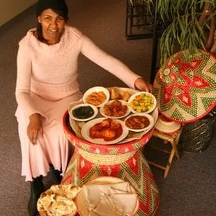 Owner Neghisti Ghebrehiwot by some of her exquisite dishes