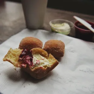 a half eaten doughnut on a napkin