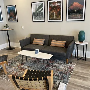 a living room with a couch and chairs