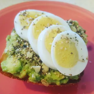 Avacado toast open faced on a ciabatta roll.