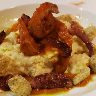 Smothered shrimp, fried okra, and cheesy grits.