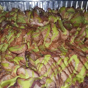 Lo'NsLo BBQ roasted and thinly sliced tri-tip drizzled cilantro lime sauce.