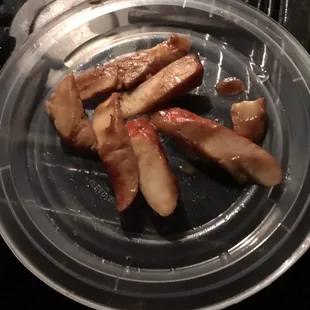 Imitation crab meat that tastes like horrible string cheese.  They add this as a &quot;filler seafood&quot;