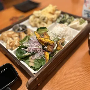 Shrimp and vegetable Tempura bento box also comes with a miso soup.