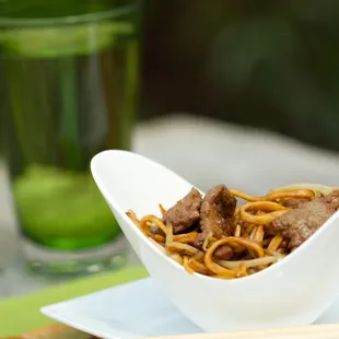 a bowl of noodles and beef