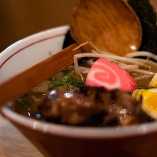 a close up of a bowl of ramen