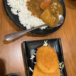 a plate of rice and a bowl of stew