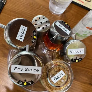 Condiments on a mini lazy Susan on each table