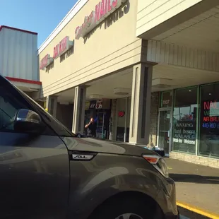 a car parked in front of a store