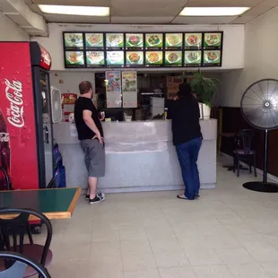 two people standing at a counter