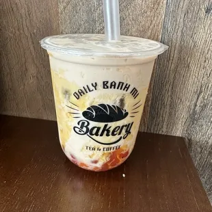 This is the peach milk tea, with dragonfruit popping boba.