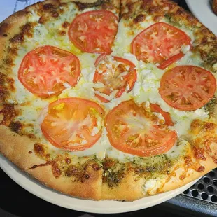 a pizza with tomatoes and cheese