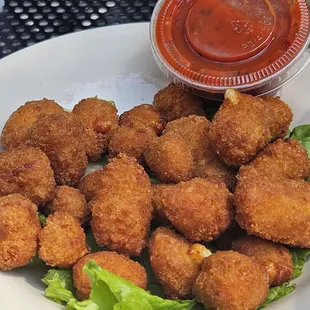 a plate of deep fried chicken nuggies