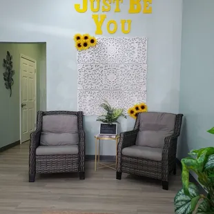 Comfy chairs and photo wall