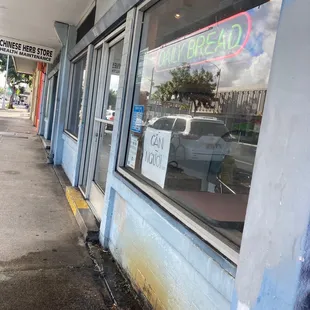 a car parked in front of a restaurant