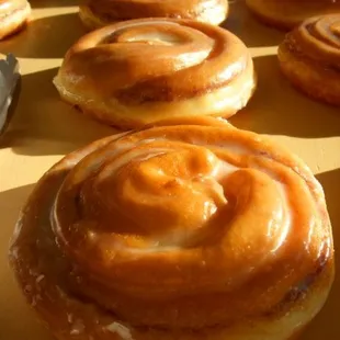 a tray of glazed donuts