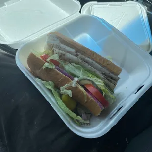 a sandwich in a styrofoam container