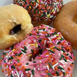a variety of donuts with sprinkles
