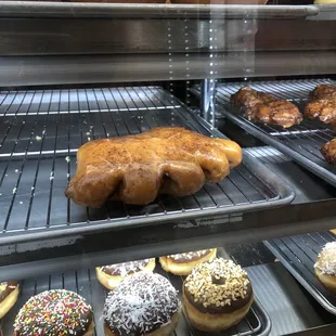 a variety of doughnuts in a display case