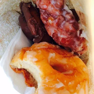 Regular glazed, chocolate old fashioned, and an apple fritter