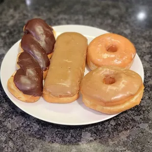 a plate of doughnuts on a countertop