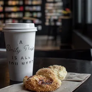 Vanilla honey oat latte, sesame Gruyère twist - @kat.eats