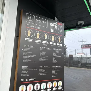 a menu on the outside of a coffee shop