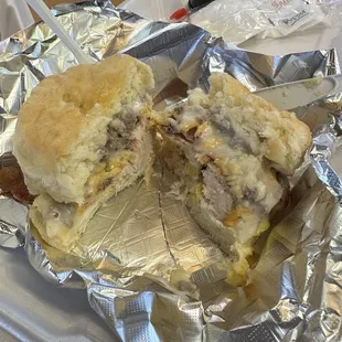 Cluck club on biscuit with gravy.