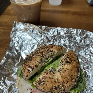 a bagel sandwich and a drink