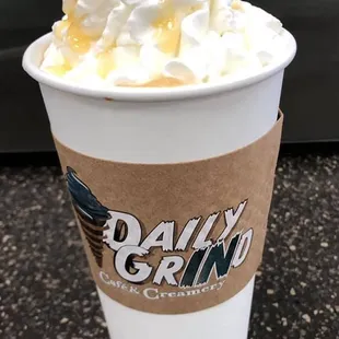 a coffee cup with whipped cream