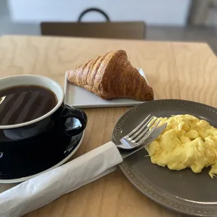 Croissant scrambled eggs and Americano