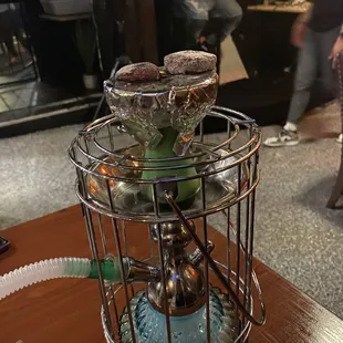 This is the coal for the hookah. I had to blow the ash off of the coal because the server never came to do it