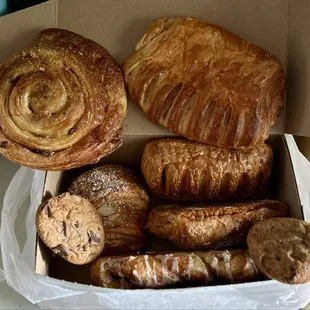 Raisin roll, almond, apple, strawberry, strawberry and cream cheese croissants, cinnamon twist, and chocolate chunk cookies.